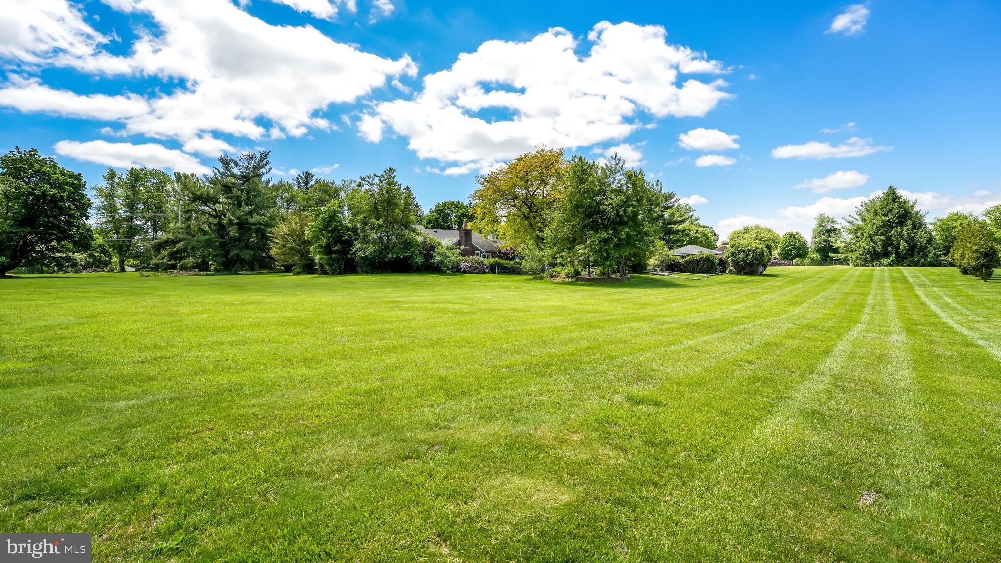 1591 Middletown Road Glen Mills, PA 19342 - Photo 5 of 55 a view of a big yard with an outdoor space and seating area