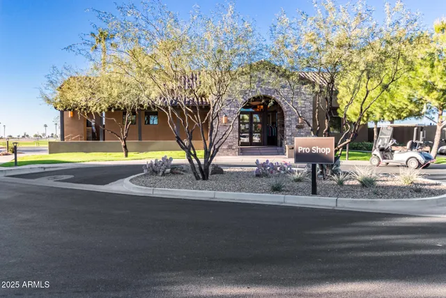 a view of a swimming pool with an outdoor seating
