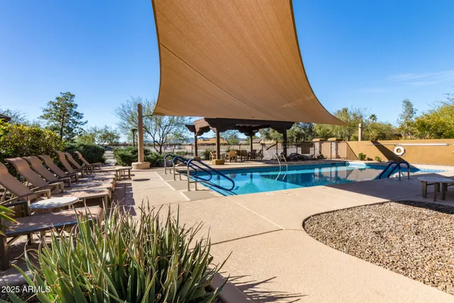 a view of a patio with a table and chairs