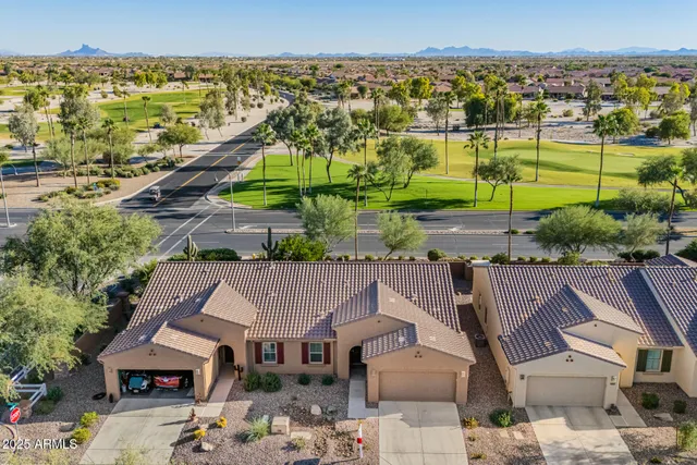 an aerial view of beach and residential space with swimming pool
