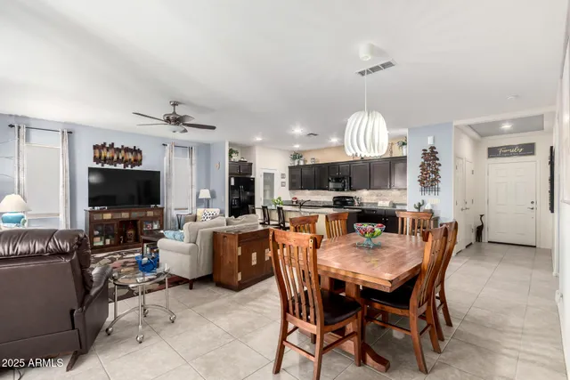 a kitchen with kitchen island granite countertop a table and chairs in it