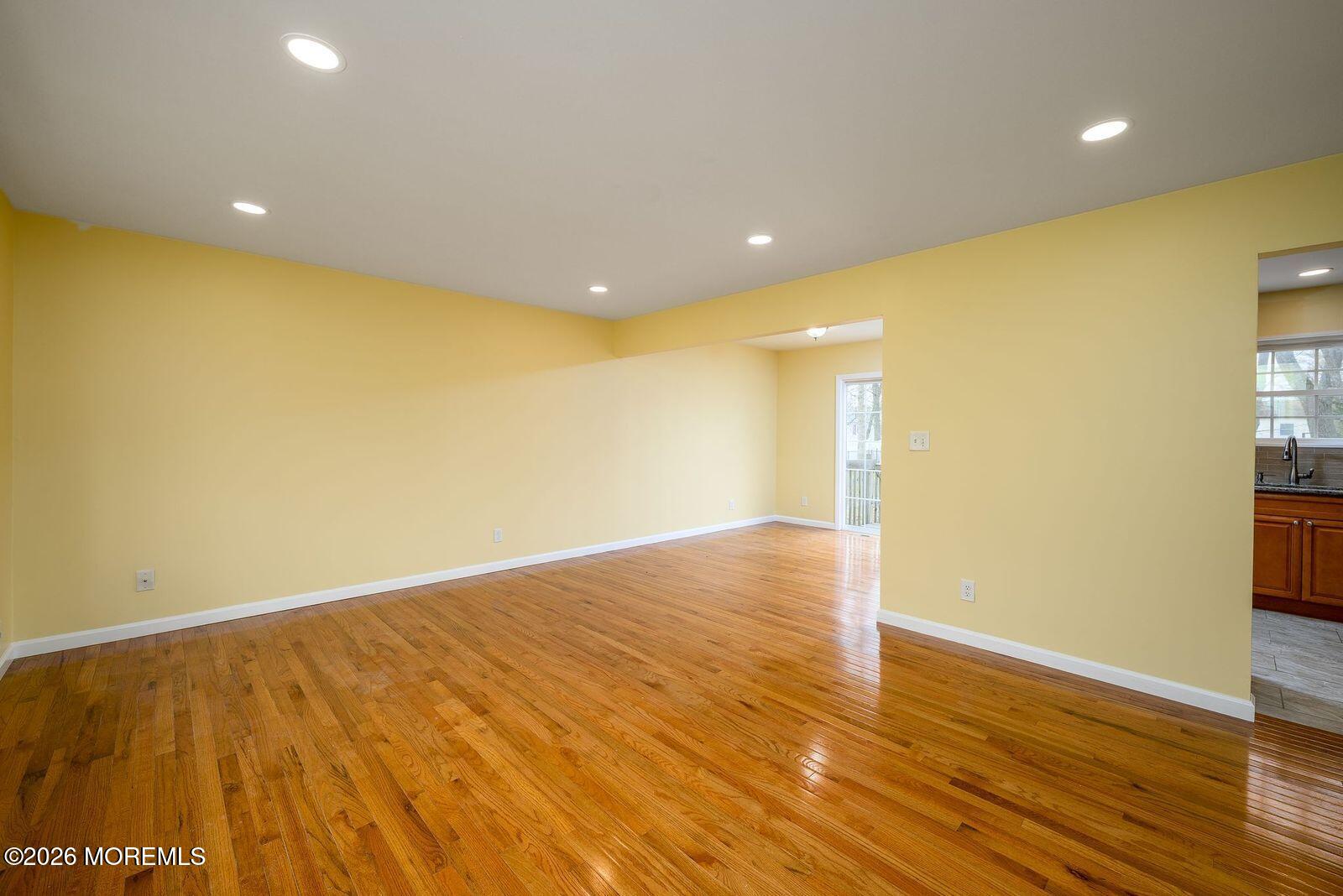 19 Princeton Drive Howell, NJ 07731 - Photo 11 of 36 a view of empty room with wooden floor