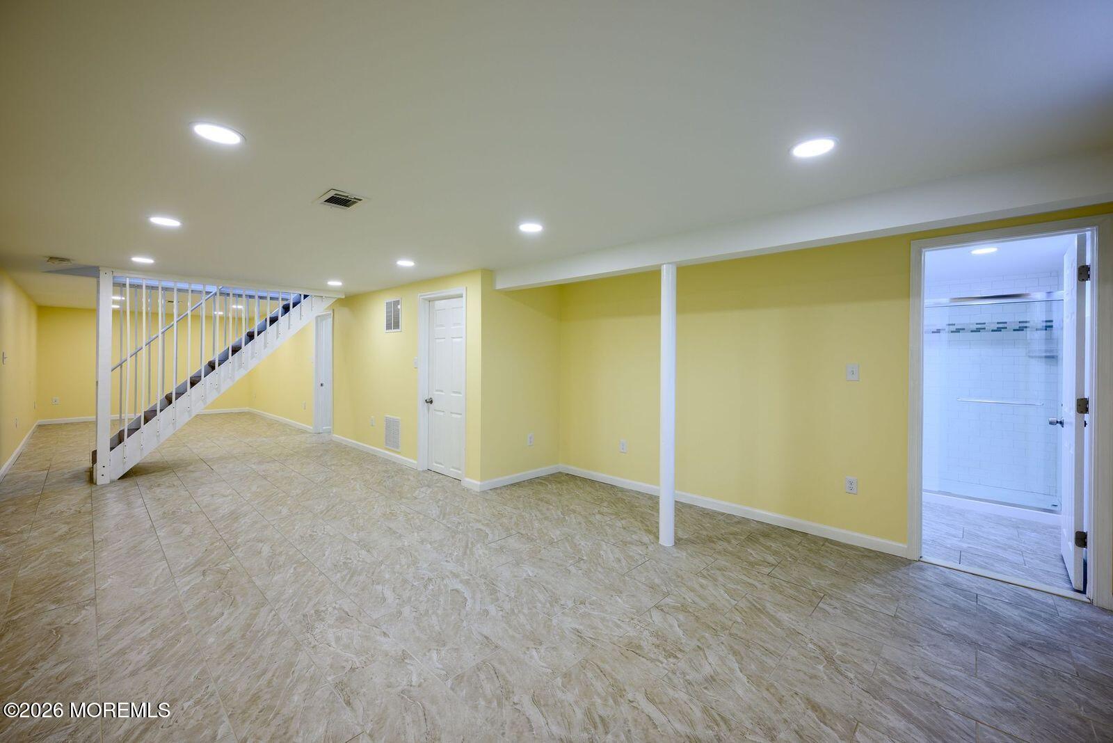 19 Princeton Drive Howell, NJ 07731 - Photo 20 of 36 an empty room with wooden floor and windows