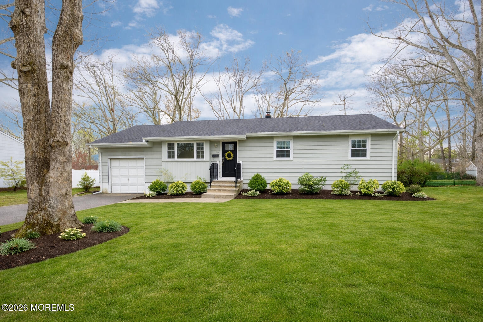19 Princeton Drive Howell, NJ 07731 - Photo 2 of 36 a front view of a house with a garden