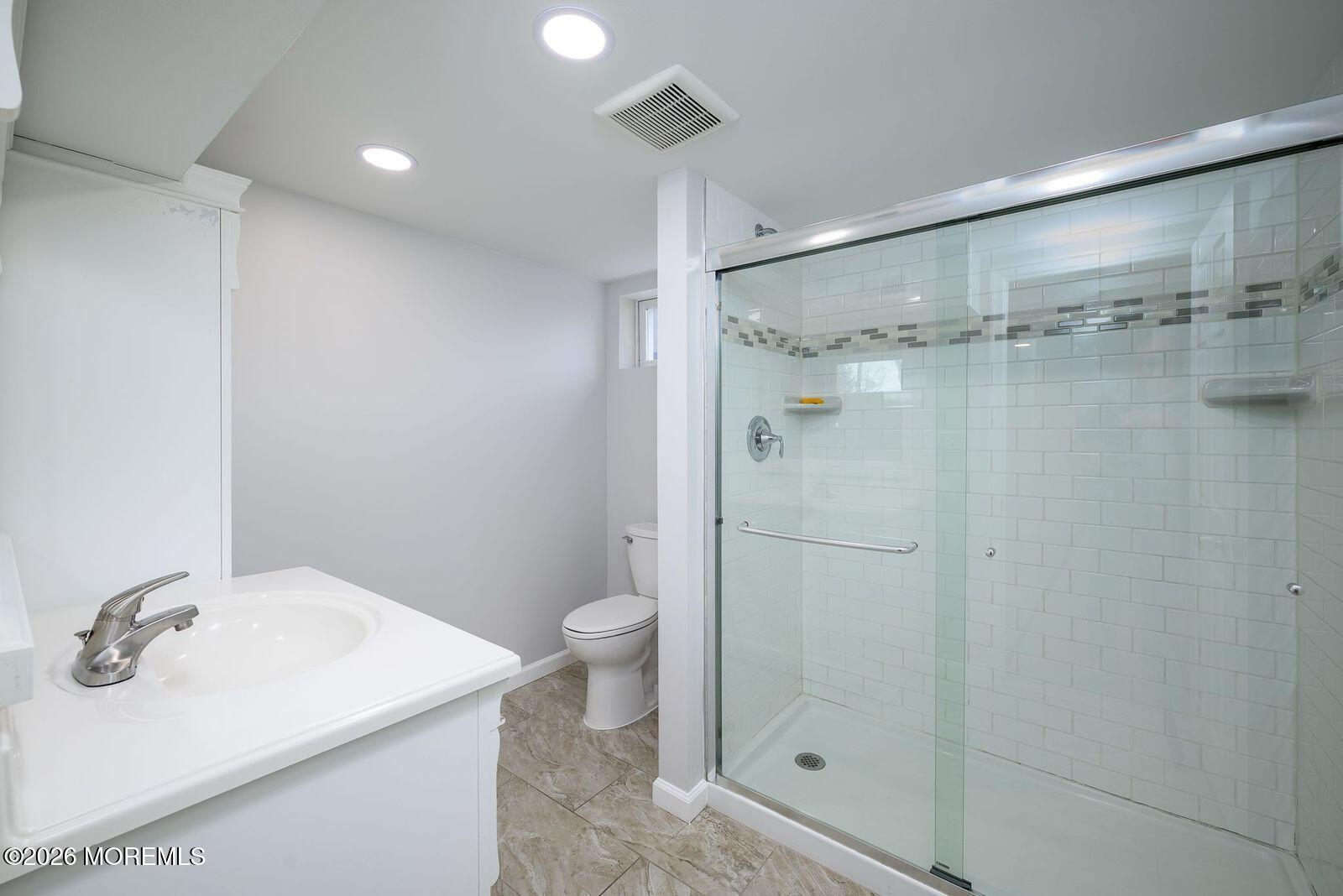 19 Princeton Drive Howell, NJ 07731 - Photo 22 of 36 a bathroom with a sink toilet and shower