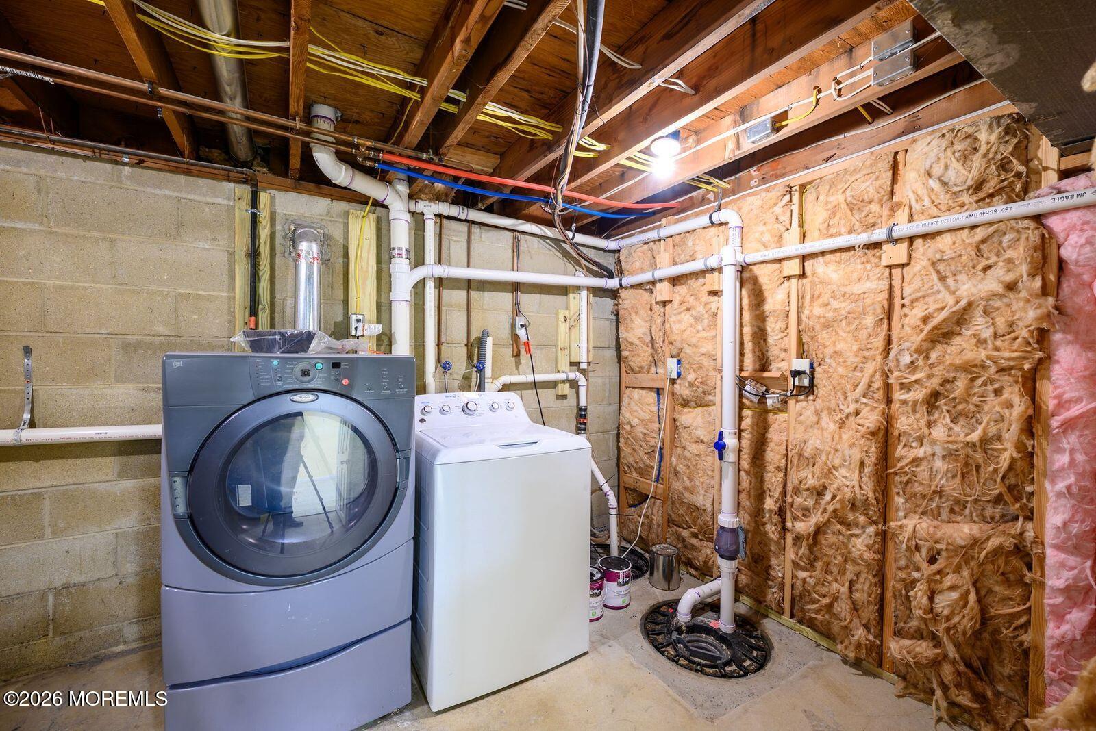 19 Princeton Drive Howell, NJ 07731 - Photo 31 of 36 a utility room with dryer and washer