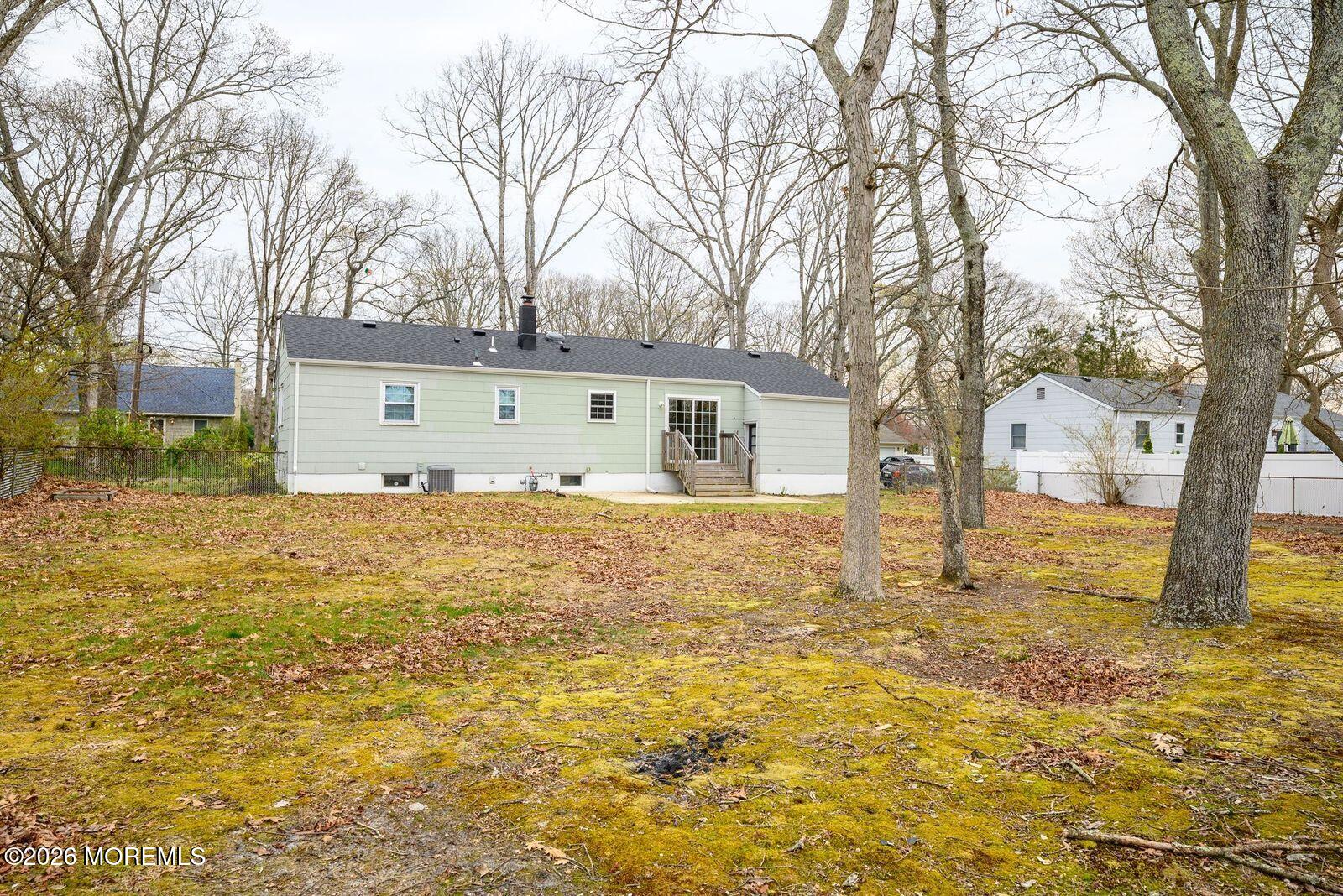 19 Princeton Drive Howell, NJ 07731 - Photo 33 of 36 a front view of house with yard and trees