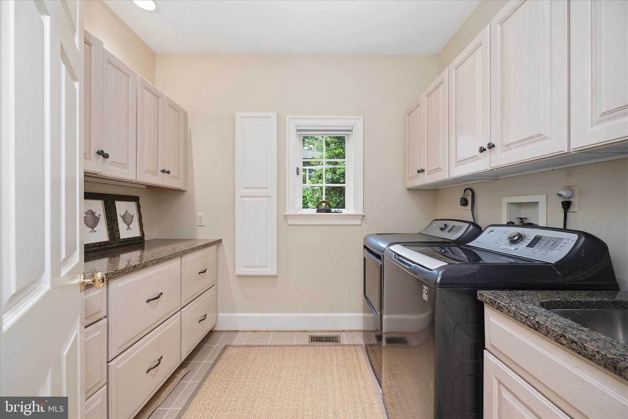 3824 Military Road Arlington, VA 22207 - Photo 23 of 54 a kitchen with granite countertop a sink stove and cabinets