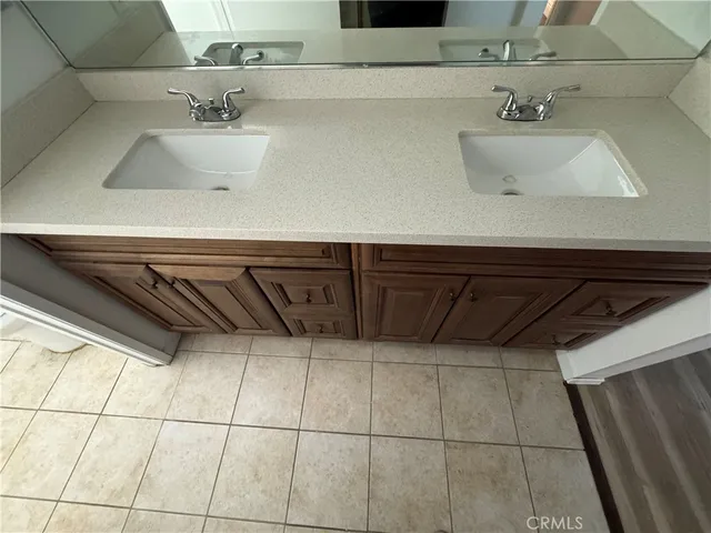a bathroom with a sink and cabinets
