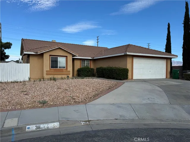 a front view of a house with garage