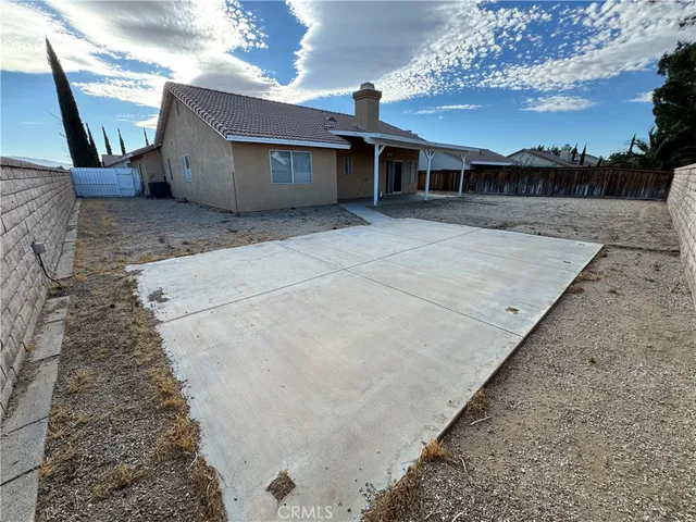 a view of a house with a snow in a yard