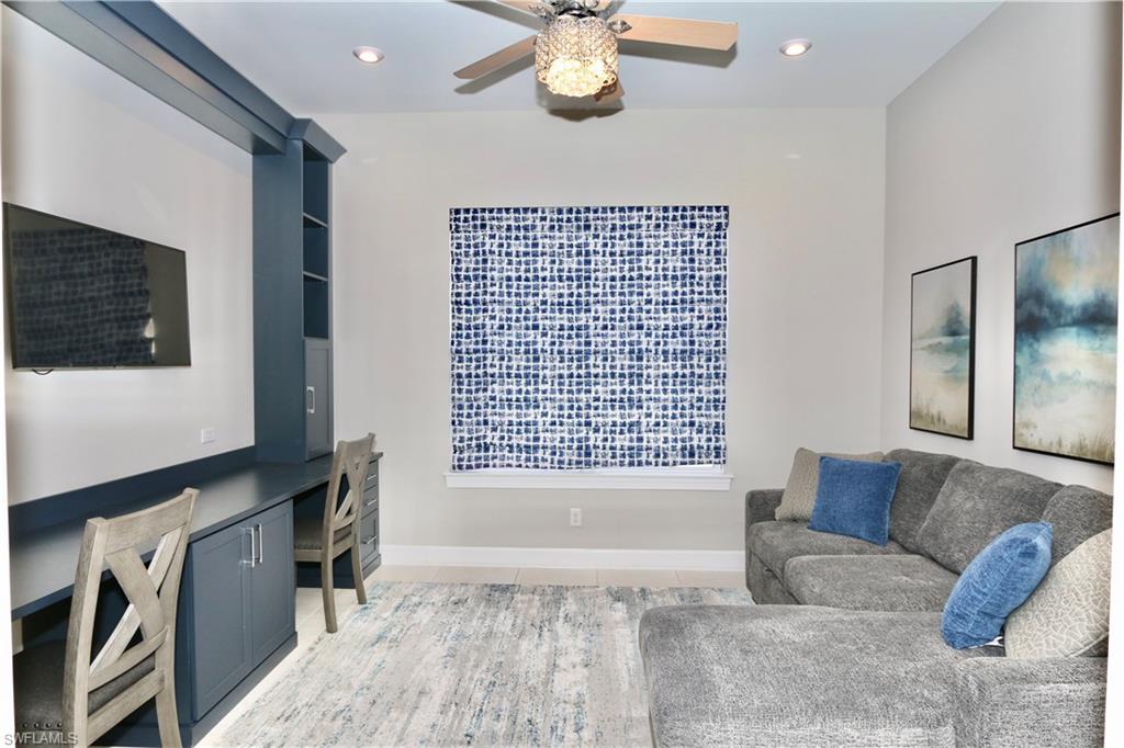 8191 Lucello Terrace North Naples, FL 34114 - Photo 11 of 42 Living area with built in desk, a ceiling fan, and recessed lighting