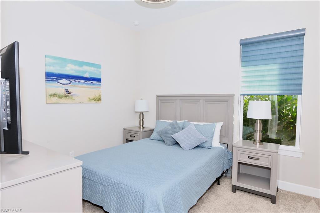 8191 Lucello Terrace North Naples, FL 34114 - Photo 17 of 42 Bedroom with light carpet