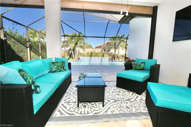 a living room with furniture and a rug