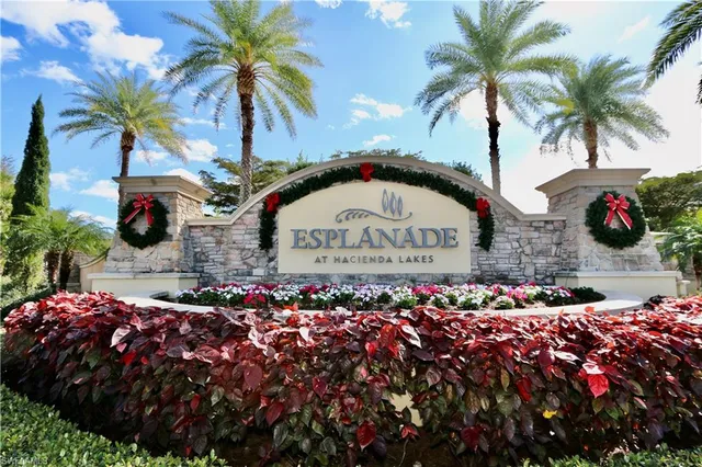 a group of people standing around a bunch of flowers