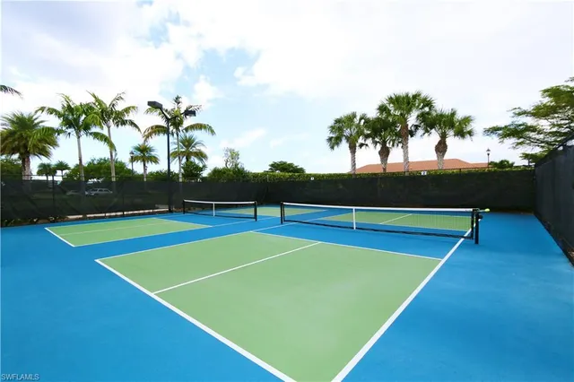 a view of an outdoor space and tennis court