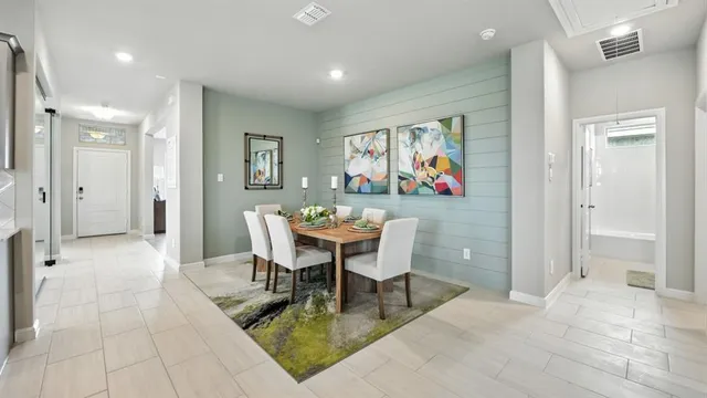 a kitchen with stainless steel appliances a sink stove refrigerator and cabinets