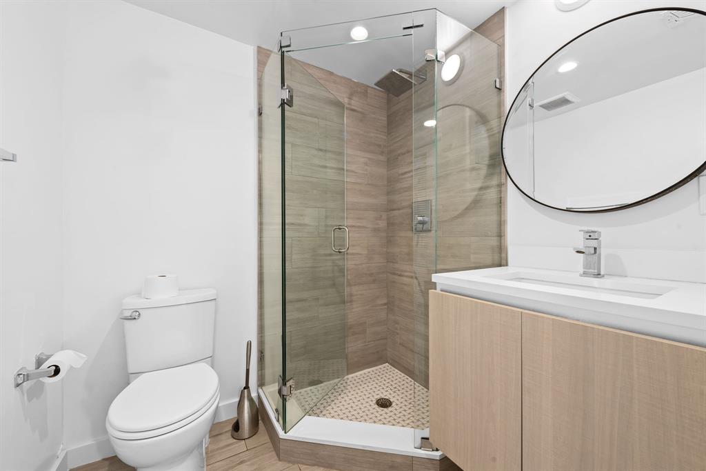 722 Northeast 15th Avenue, Unit 2 Fort Lauderdale, FL 33304 - Photo 15 of 27 a bathroom with a sink a toilet and shower