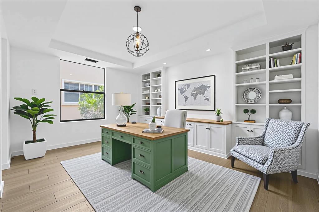 722 Northeast 15th Avenue, Unit 2 Fort Lauderdale, FL 33304 - Photo 20 of 27 a view of a livingroom with furniture window and wooden floor
