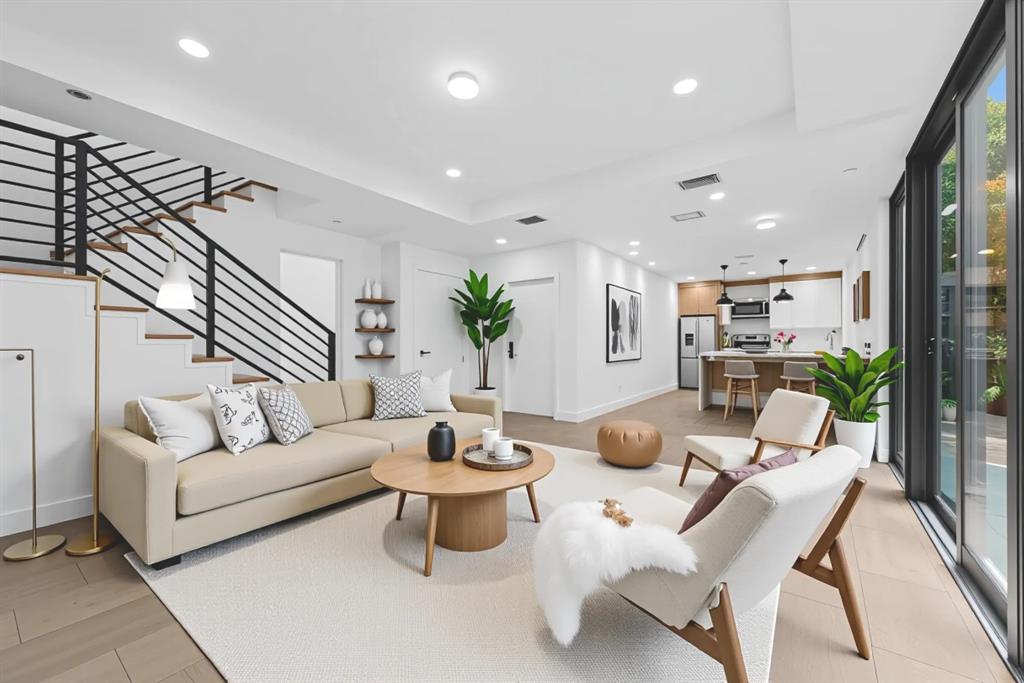 722 Northeast 15th Avenue, Unit 2 Fort Lauderdale, FL 33304 - Photo 2 of 27 a living room with furniture and wooden floor