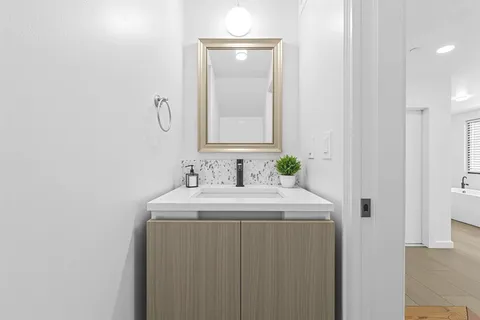 a bathroom with a sink and a mirror