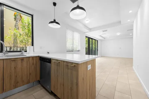 a kitchen with a cabinets and chandelier