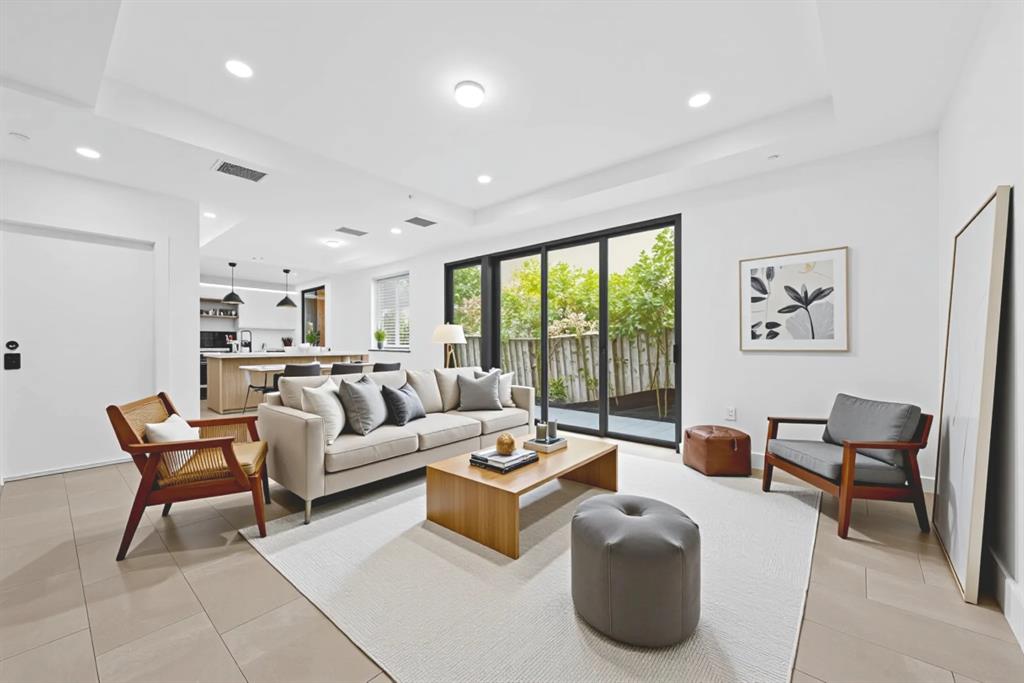 722 Northeast 15th Avenue, Unit 2 Fort Lauderdale, FL 33304 - Photo 6 of 27 a living room with furniture and a large window