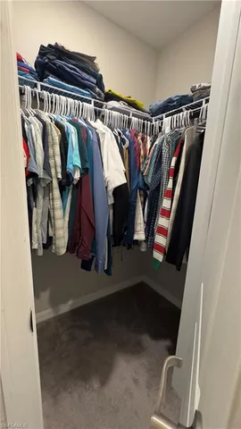a view of staircase with furniture and windows