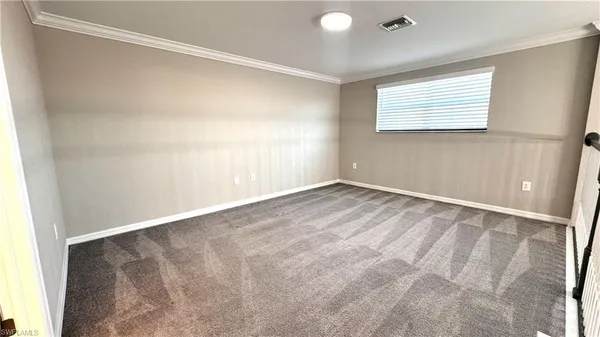 a view of a bathroom with glass door and shower