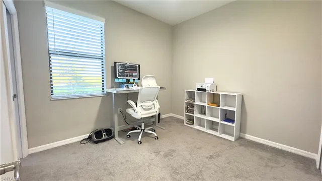 an aerial view of a house with a garden and lake view