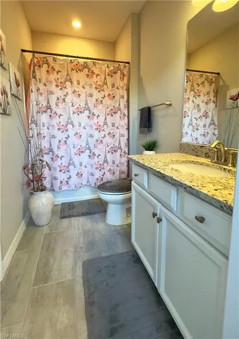 an aerial view of a residential houses with outdoor space