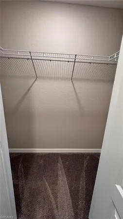 an aerial view of a house with a garden and lake view