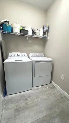 a view of a house with backyard porch and sitting area