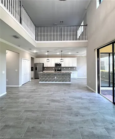 a view of livingroom with kitchen