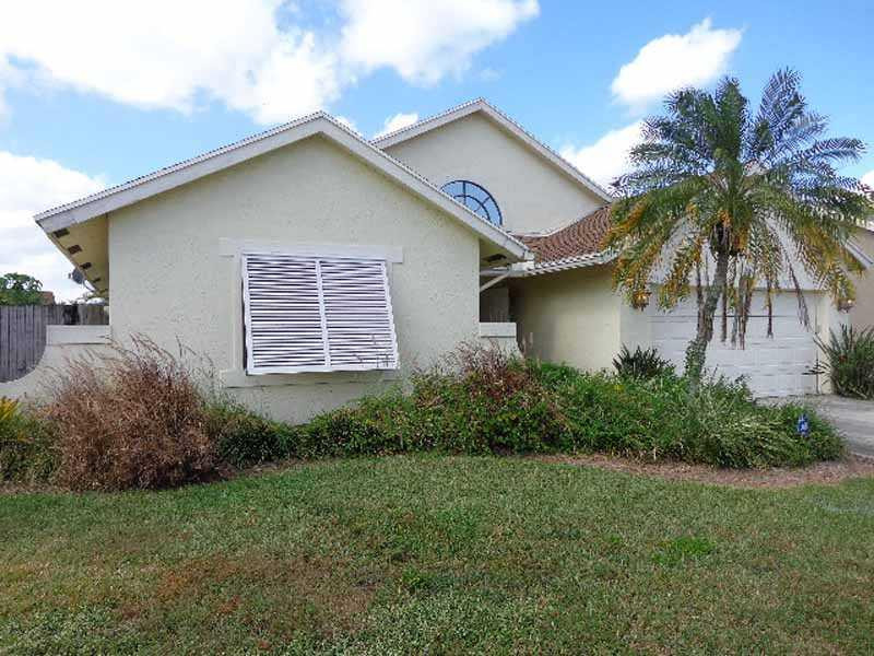 22565 Blue Fin Trail Boca Raton, FL 33428 - Photo 1 of 14 a front view of house with yard and green space
