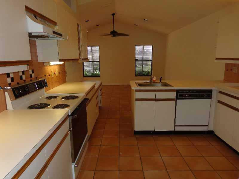 22565 Blue Fin Trail Boca Raton, FL 33428 - Photo 3 of 14 a kitchen with a stove and a sink