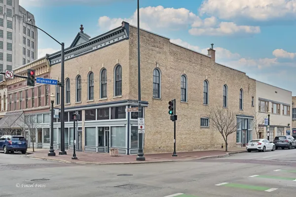 a city street lined with buildings and cars