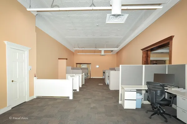 a workspace with furniture and window