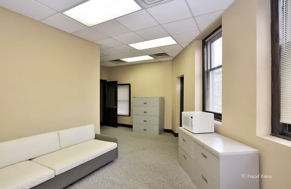 a workspace with furniture and lamp