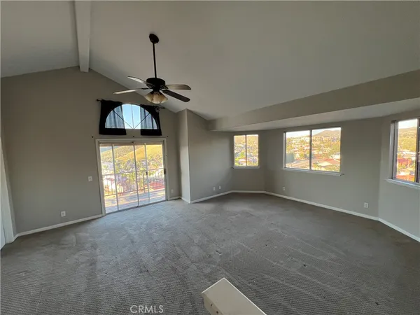 a view of empty room with windows