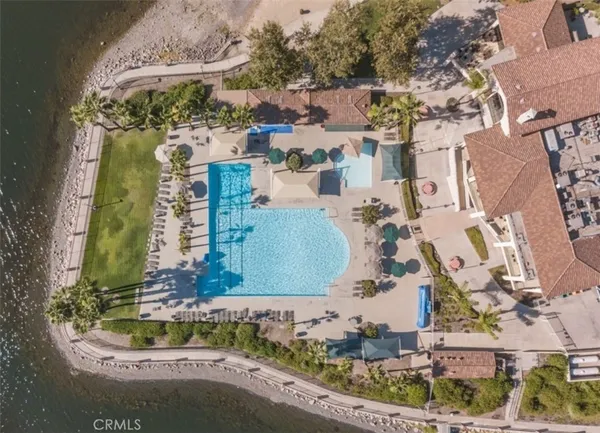 an aerial view of a residential houses with outdoor space