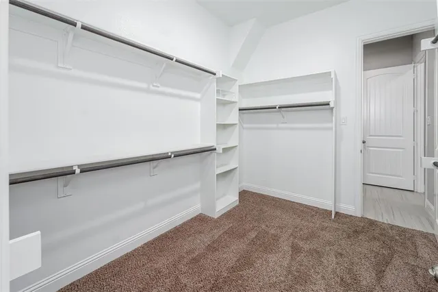 a view of an empty walk in closet