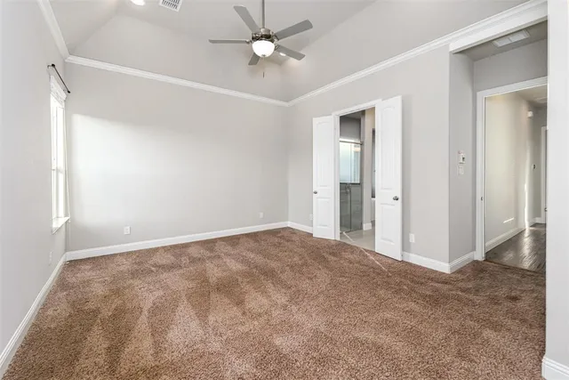 a view of a big room with closet and a ceiling fan