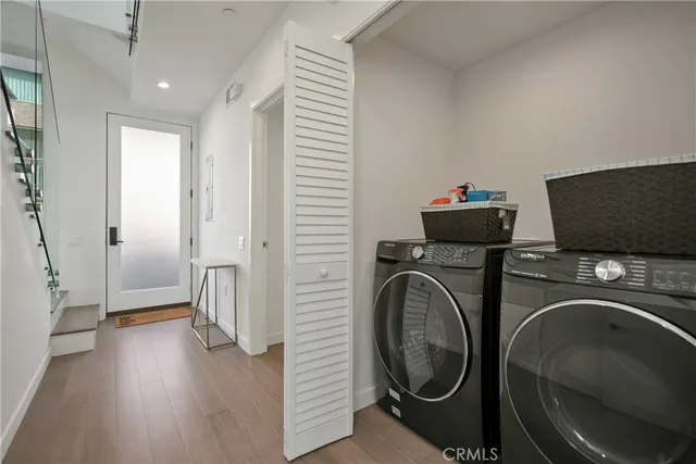 a view of a hallway with washer and dryer