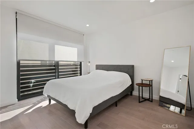 a bedroom with a bed and a cabinets