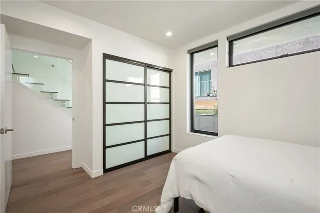 a large white bed in a white room