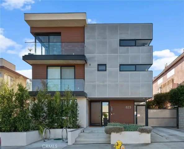 a front view of a house with garage