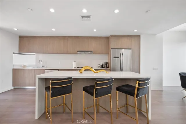 a kitchen with a sink cabinets and window