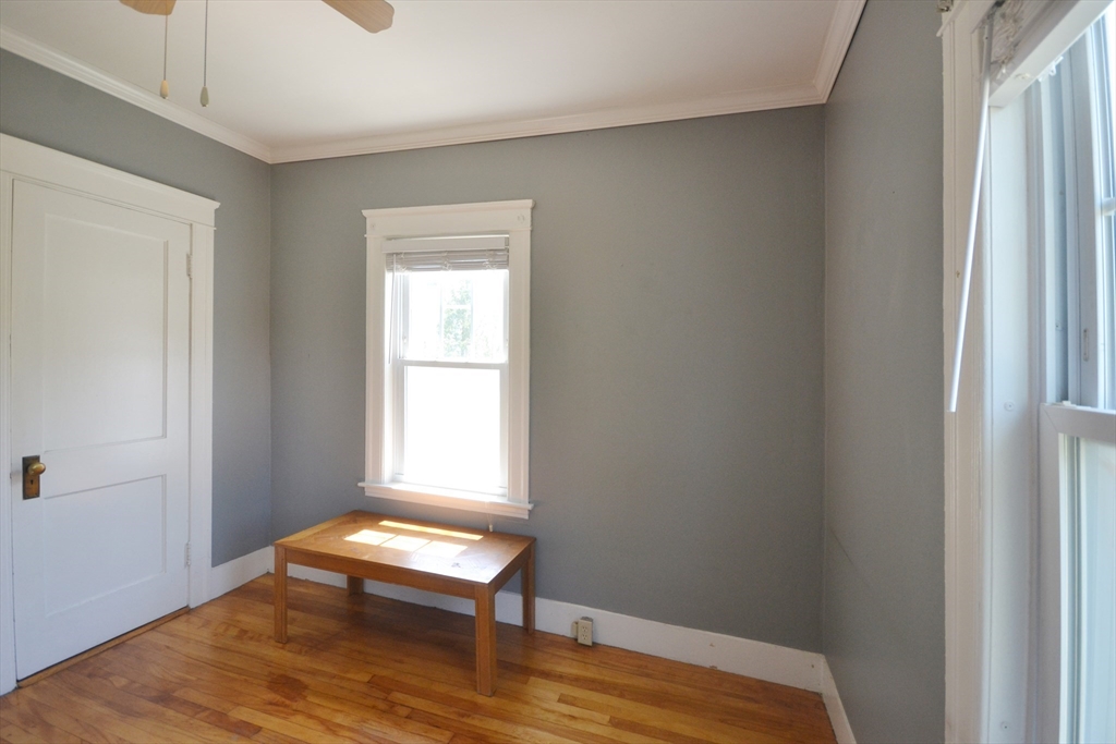 118 King Philip Road Worcester, MA 01606 - Photo 13 of 28 a room with a window and a wooden floor