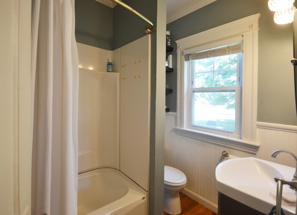 118 King Philip Road Worcester, MA 01606 - Photo 19 of 28 a bathroom with a granite countertop sink toilet a shower and a bathtub